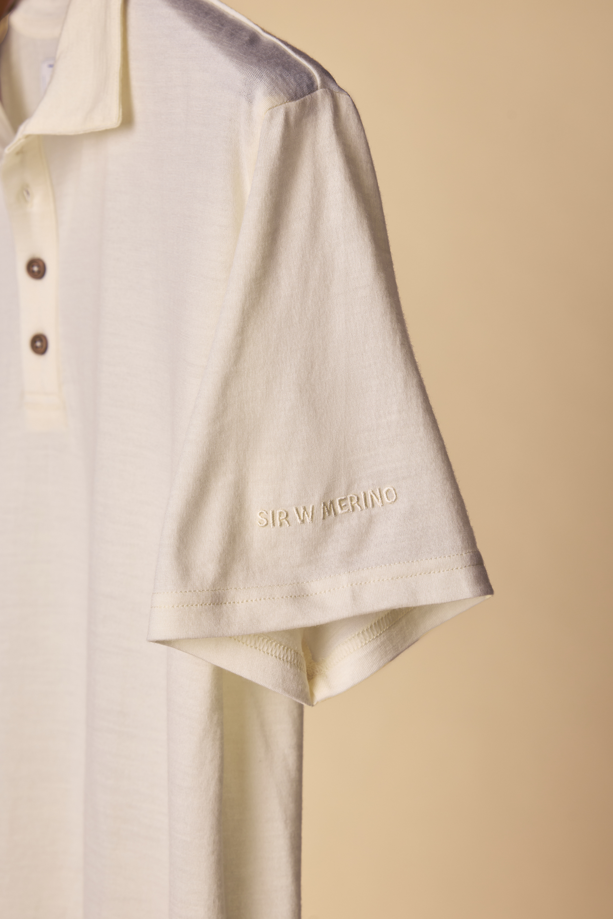 Close-up of embroidery on the George polo collar