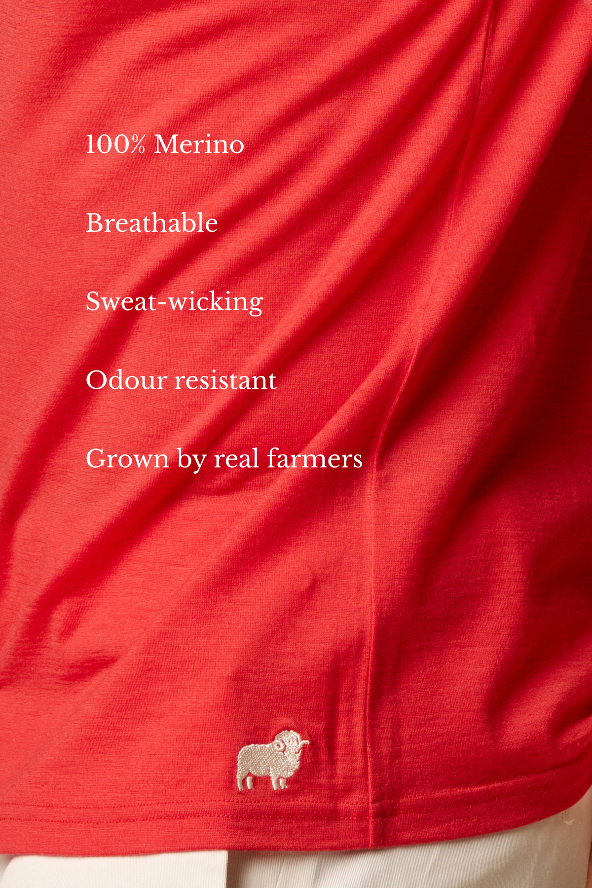 Sir W. Merino Bruce Poppy Red shirt on a hanger against a beige background #Color_Poppy Red