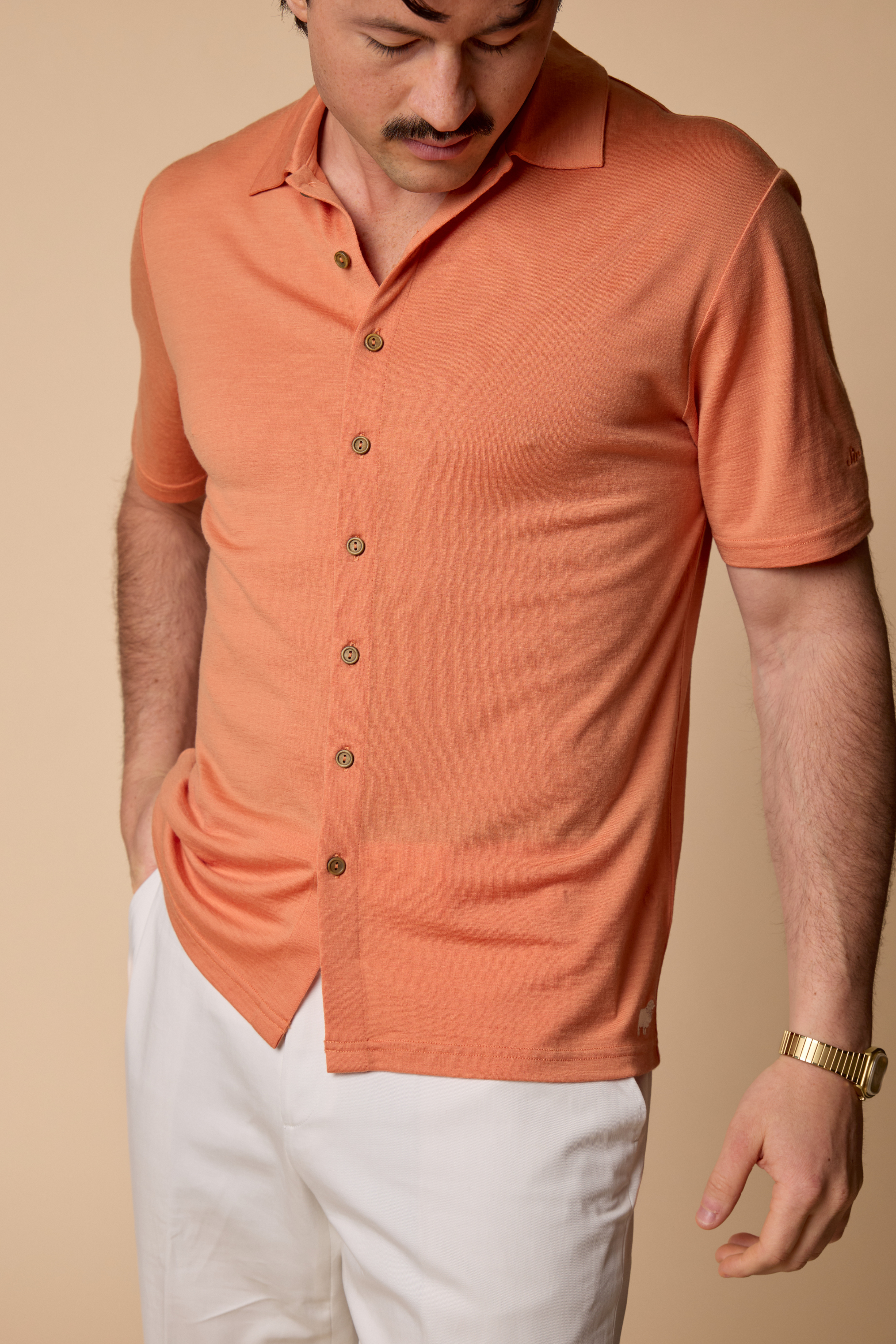 Sir W. Merino Bruce Caramel untucked, white pants side shot