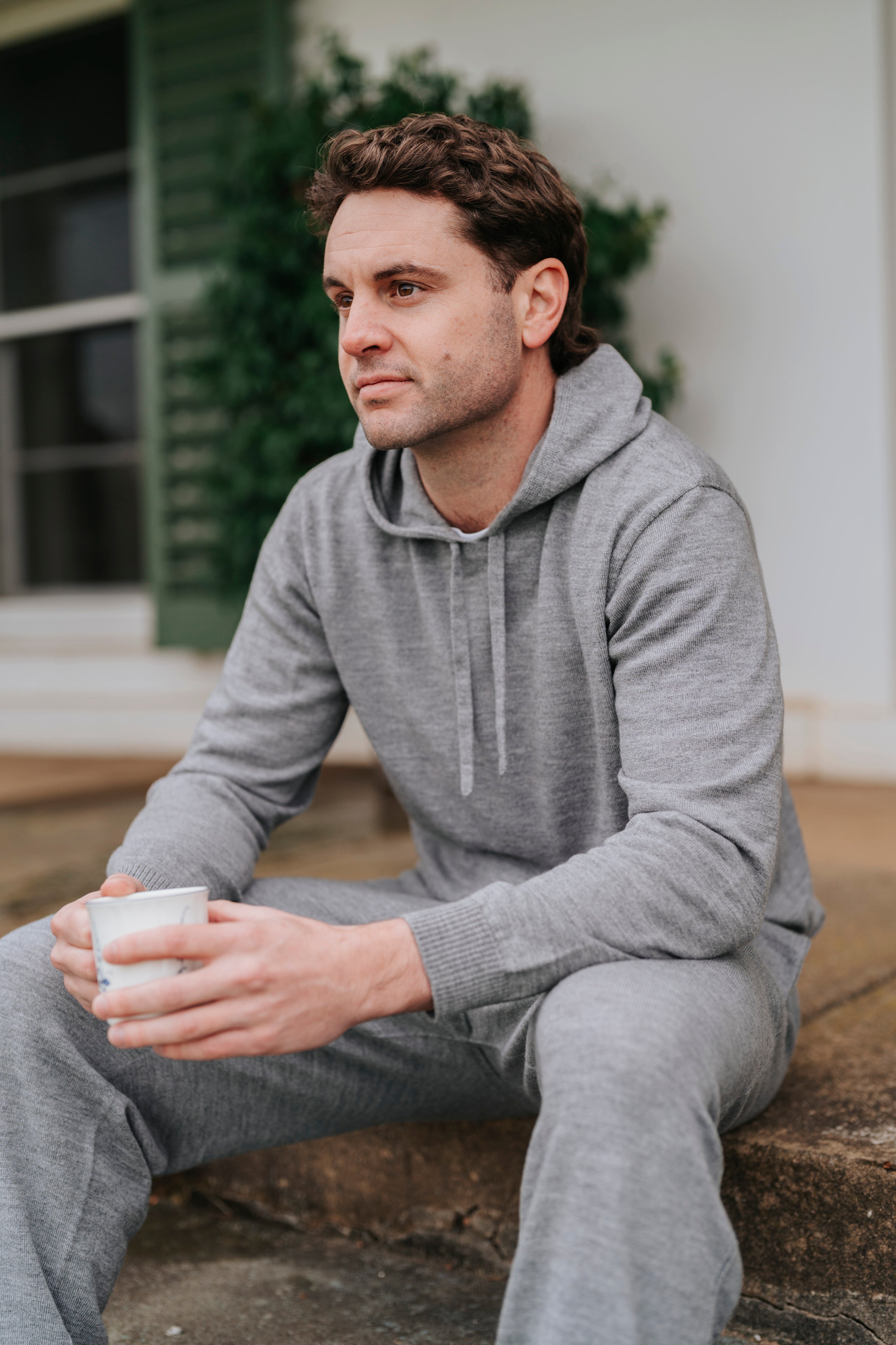 Man in gray Merino wool hoodie and pants