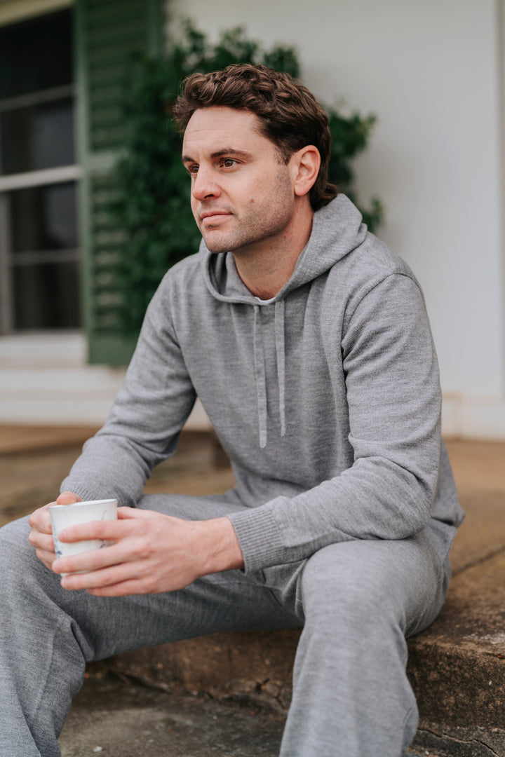 Man in gray Merino wool hoodie and pants