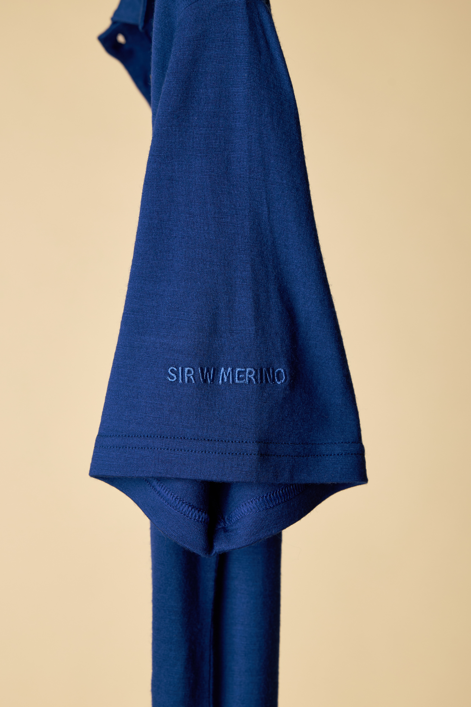 SIR W .MERINO royal blue polo with embroidered logo.