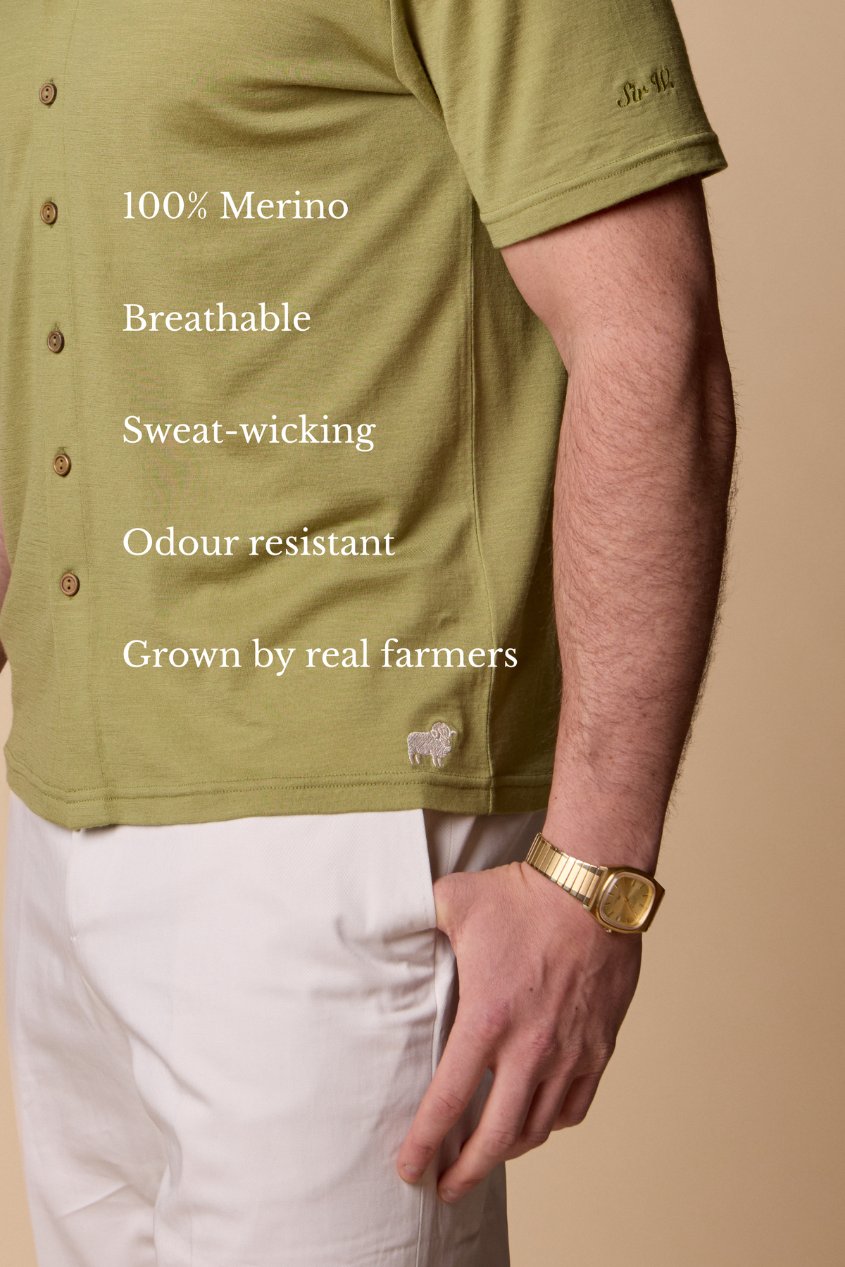 Man wearing a Sir W. Merino Bruce Olive Green shirt and white pants with a brown belt #Color_Olive Green