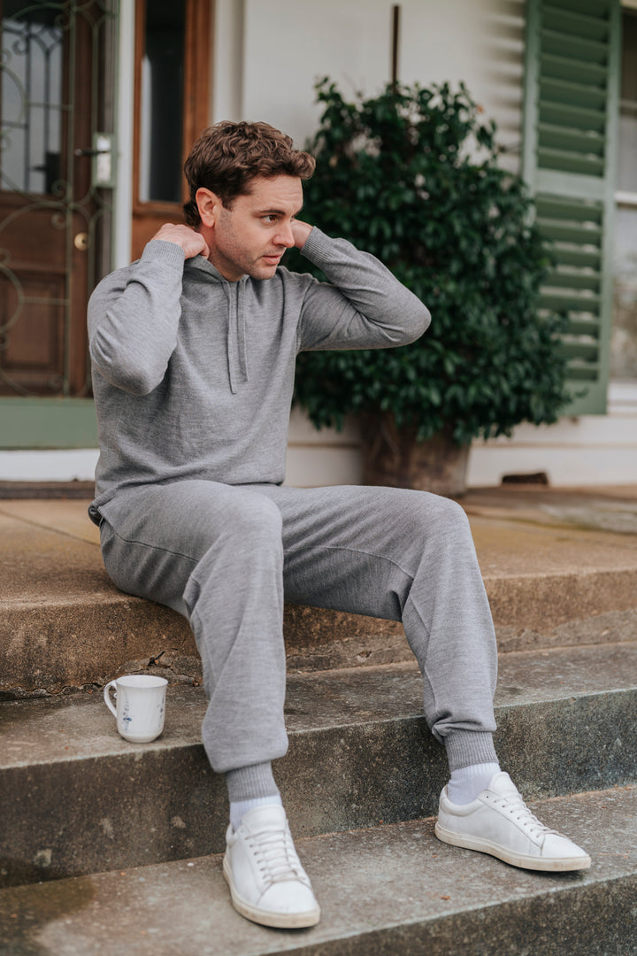 Man in gray Merino wool hoodie and pants 