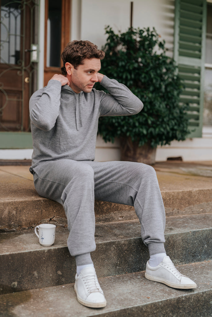 Man in gray Merino wool hoodie and pants 