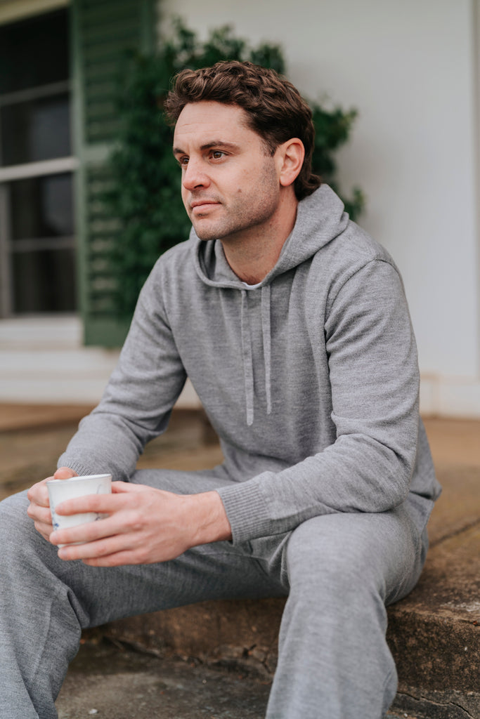 Man in gray Merino wool hoodie and pants 