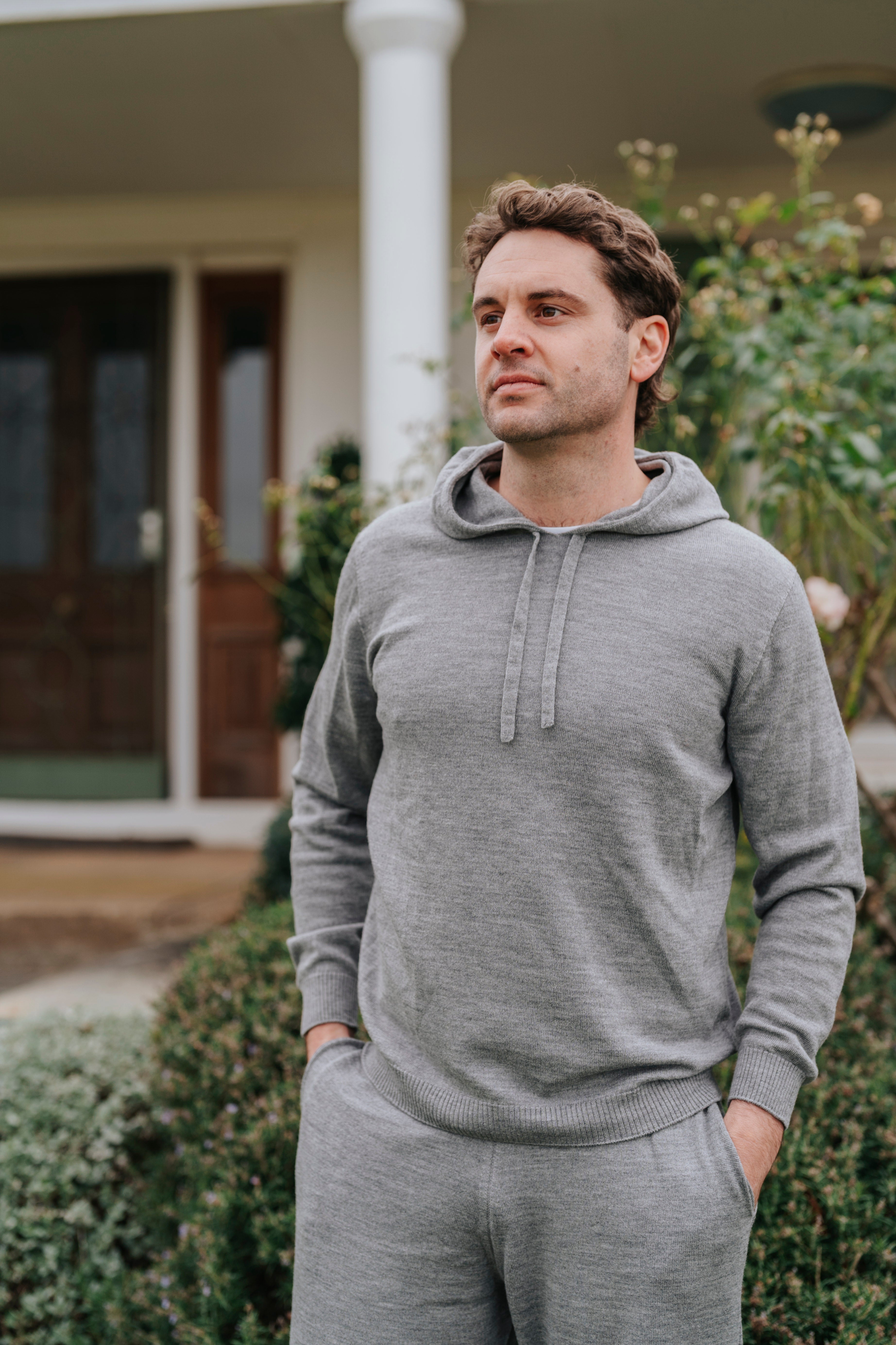 Man in gray Merino wool hoodie and pants 
