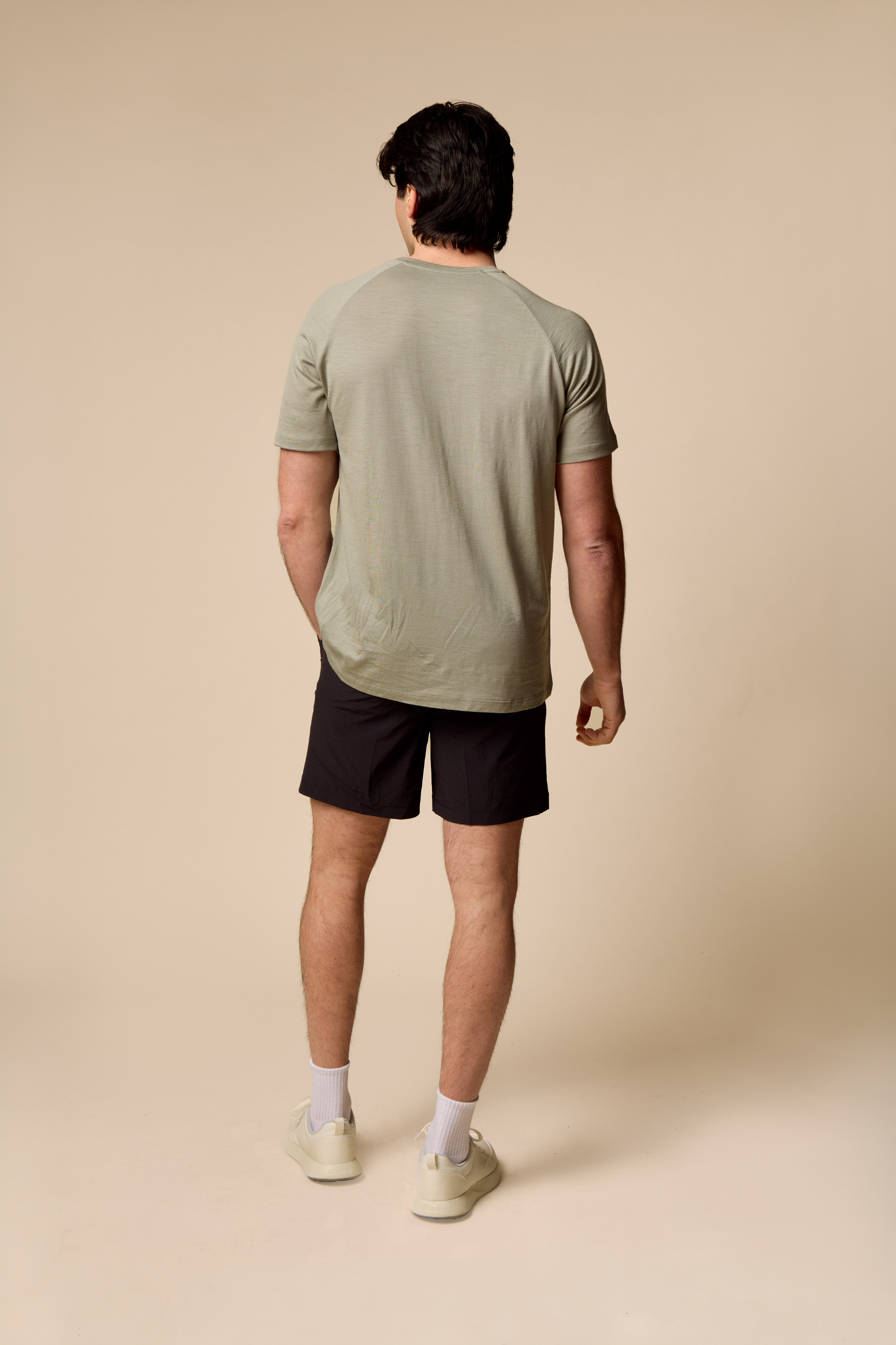 Man wearing Sir W. Merino cassius shadow grey tee from the back