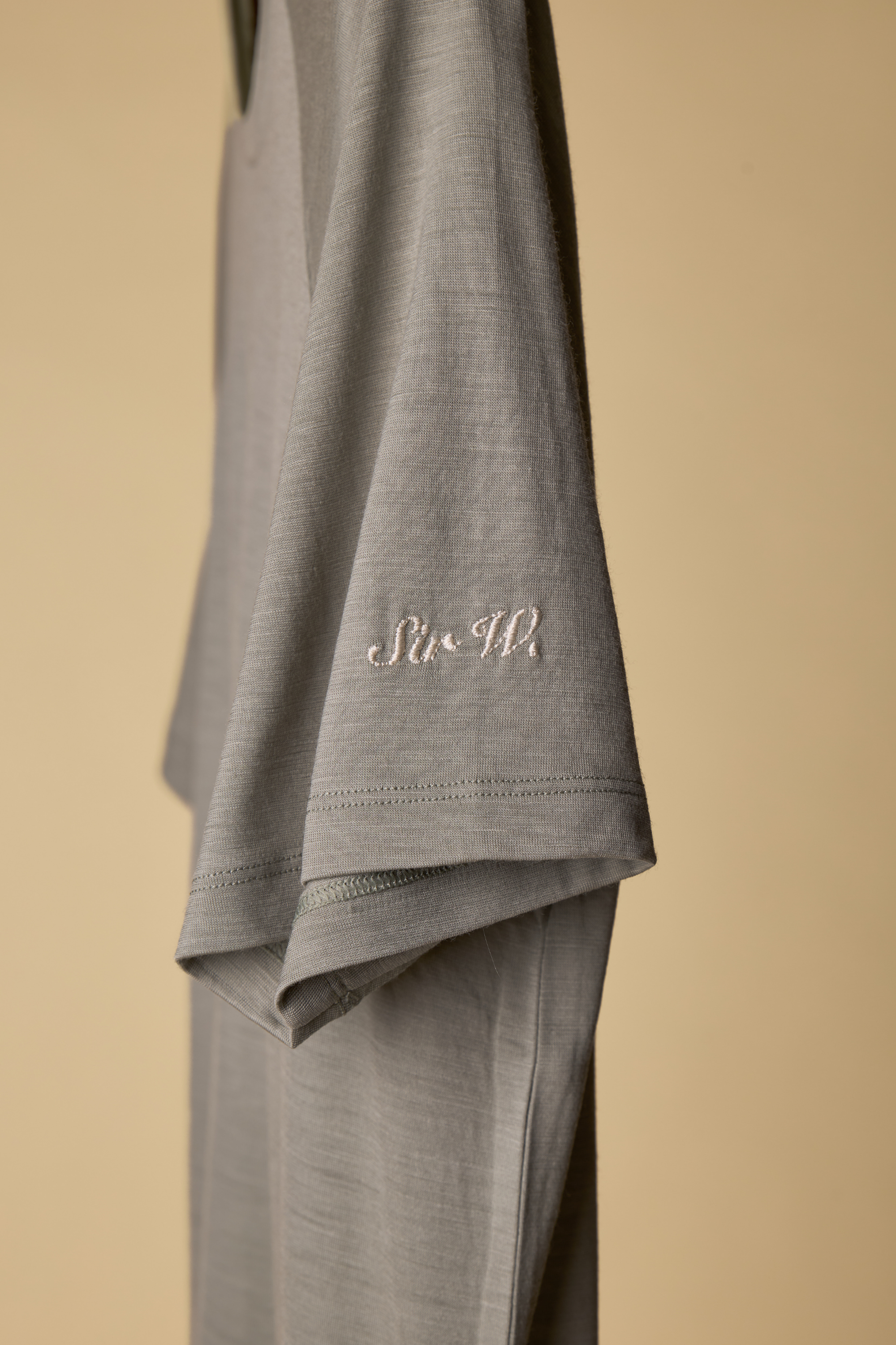 Sir W. Merino cassius shadow grey tee hanging with logo